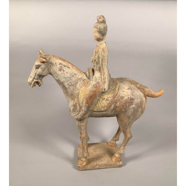 Terracotta sculpture of a horseman, Han Dynasty (206 BC-220 AD) , Mingqi period, polychrome painted terracotta. Depicts a...