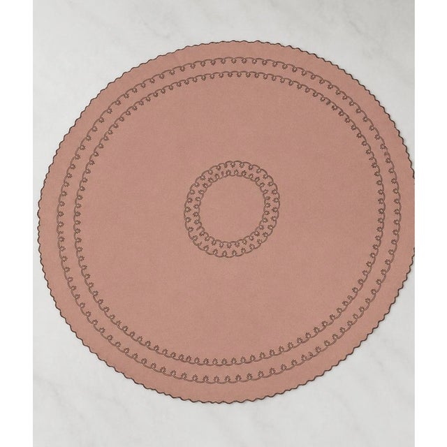 Inspired by the warmth of an Italian holiday table, this elegant round linen dining set features a rich ginger-colored...