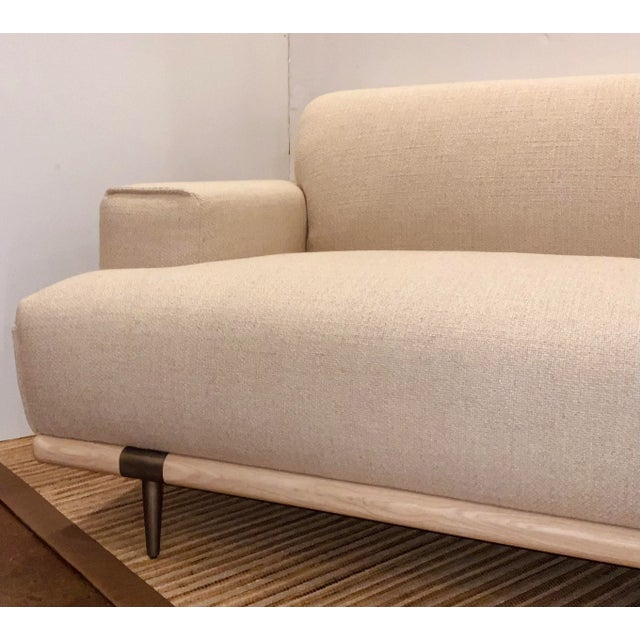 Stylish Organic Modern Oatmeal Sofa, white ash wood base, bronze finished metal legs, performance fabric, showroom floor...