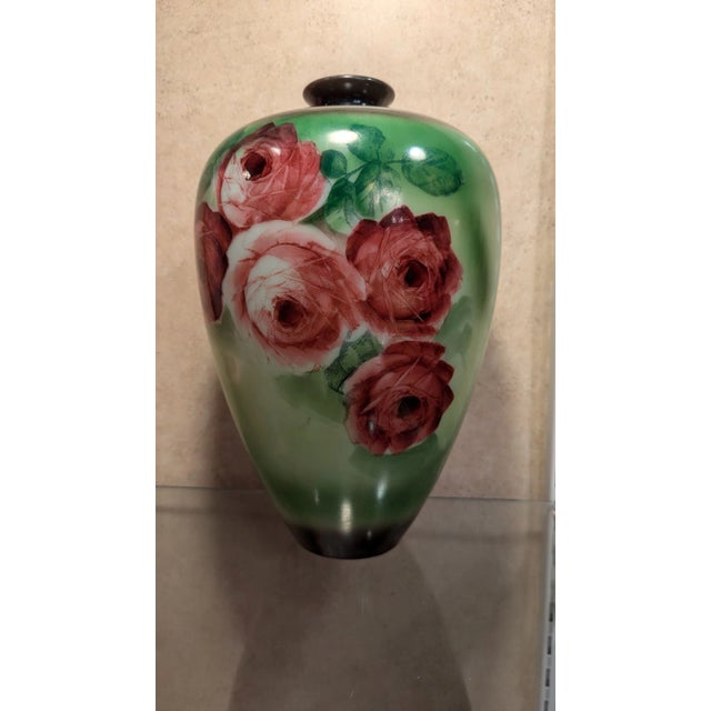 Victorian glass bulbous vase hand painted in greens with large red roses.