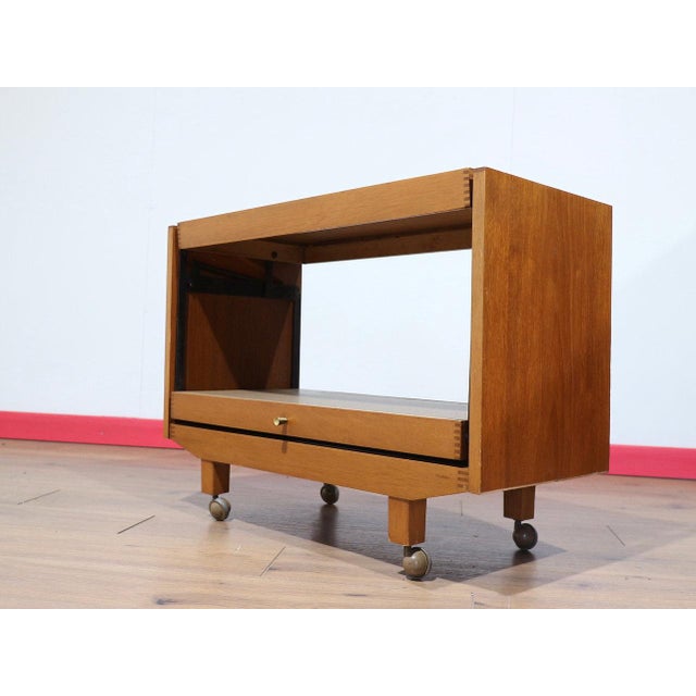 This Mid Century Modern Vintage Teak Metamorphic Folding Coffee Dining Table is a clever piece of mid century furniture...