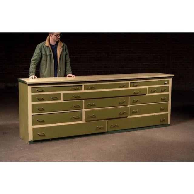 Large-scale counter cabinet likely produced for general store or mercantile use, designed to organize a wide variety of...