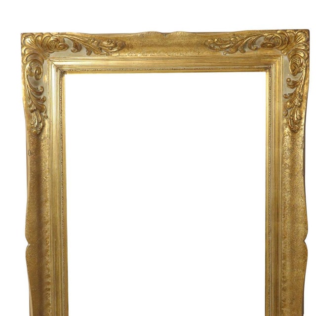 Large gilded vintage pine frame with a beautiful aged patina, XL size, entirely in classic Baroque style, decorated with...