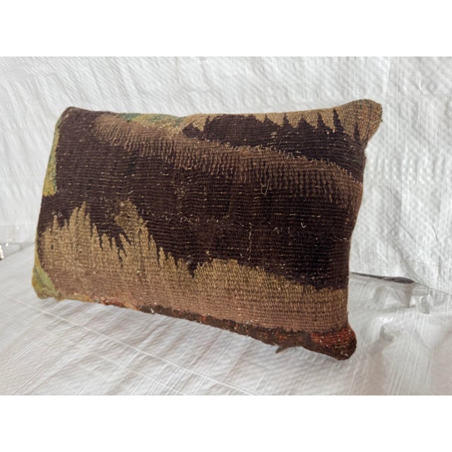 This rare 17th century Flemish tapestry pillow is crafted from an authentic antique tapestry fragment originating from the...