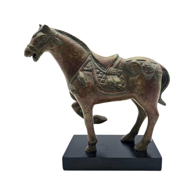 This sculptural horse is a late 20th-century reproduction inspired by iconic Tang Dynasty equestrian figures celebrated...