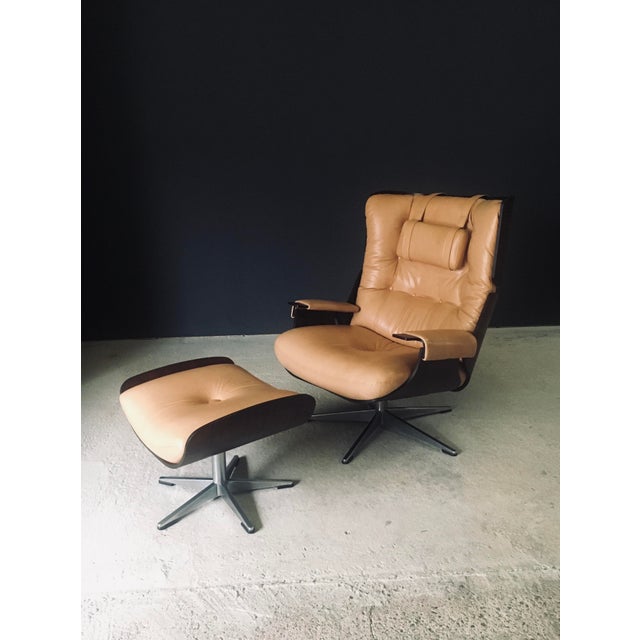 Vintage Midcentury Modern Design Leather Lounge Chair & Ottoman. Made in Germany, 1960's period. In the manner of the...