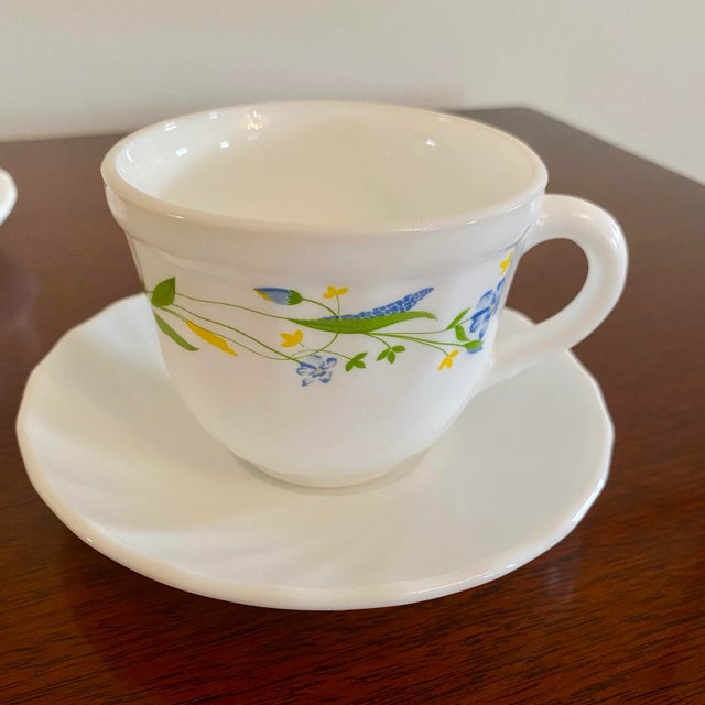 Delightful vintage RAK Arc International milk glass cups and saucers, made in the U.A.E. and finished with a charming...