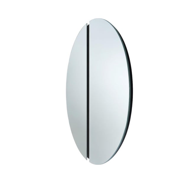A modern minimalist split circle wall mirror composed of two equal half moon panels separated by a narrow 1" black center...