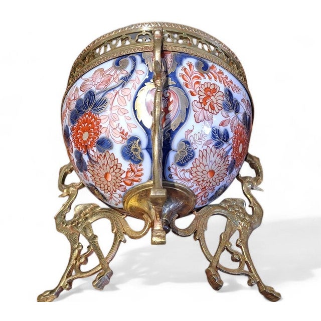 This splendid Imari porcelain bowl, embellished with an elegant gilt-bronze mount, is a classic example of the eclectic...