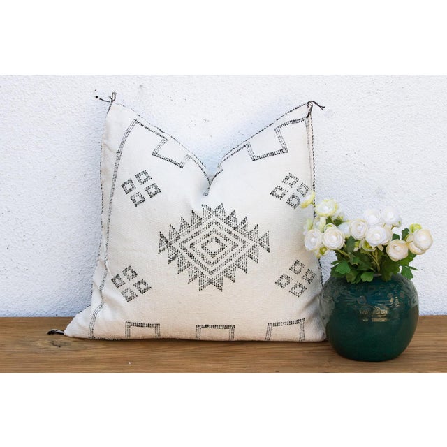 Make a graphic statement with this handcrafted Moroccan cactus silk pillow, measuring approximately 24 inches square....