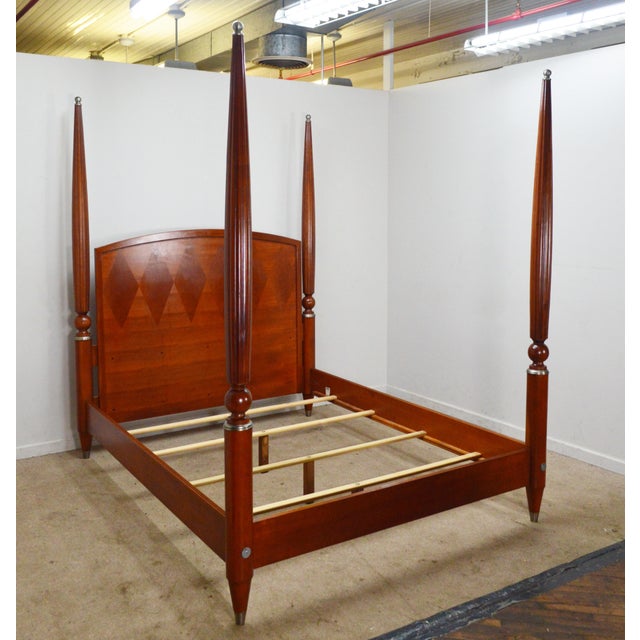 Queen Bed by Ethan Allen. Store item #541. It features reeded posts and comes with slats.