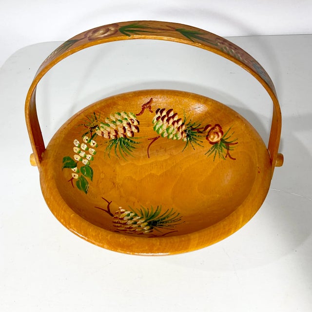 This is a lovely fall decorative bowl from the 1950s. It’s carved wood, which we believe is maple with a handle that folds...