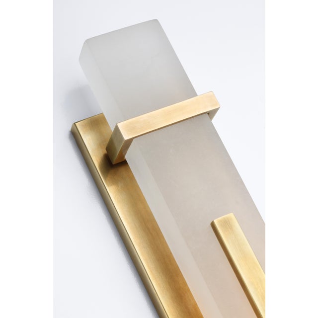 Malik Large Sconce in Hand-Rubbed Antique Brass with Alabaster Designer: Ian K. Fowler Height: 19.25" Extension: 3"...