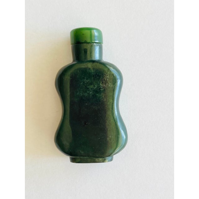Nephrite Jade Snuff Bottle – Spinach Green with Jade Stopper A handsome spinach green nephrite jade snuff bottle,...