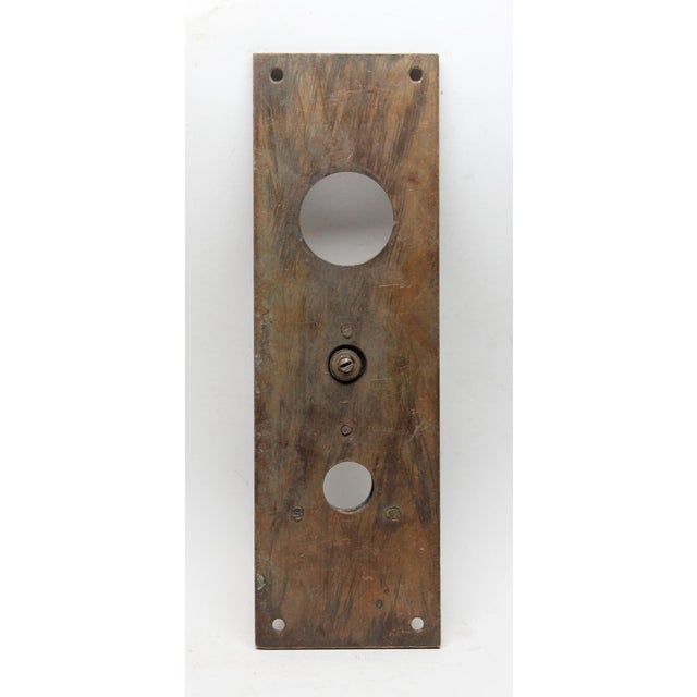 Vintage brass door knob plate with door bell button and lock insert. The original mounting screws are not available. Good...