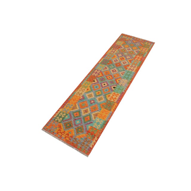 Add a touch of elegance to your home with this casual chic hand woven Tribal Kilim wool rug. Constructed on a loom by...