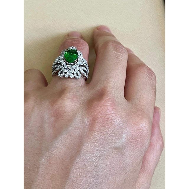 Approximately 4 Carat Oval Tsavorite and 2.9 Carat Diamond in 18 Karat White Gold Ring Estate Size 6.5 Tsavorite of this...