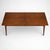 A refined mid-century teak dining table by Gordon Russell of Broadway, showcasing the maker’s renowned craftsmanship and...