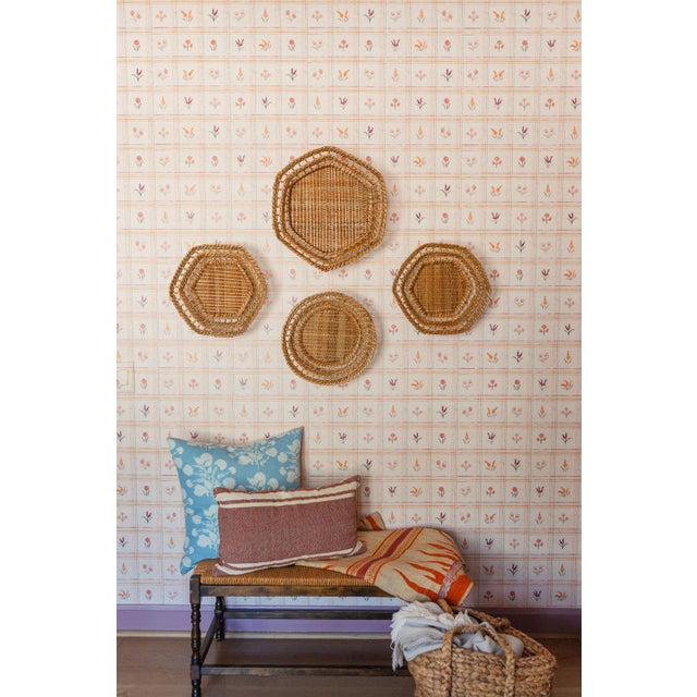These baskets are handwoven by artisans in India and are the perfect way to add texture to a bookshelf, table, or wall....