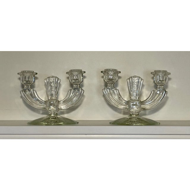 A pair of two-armed art deco glass candlestick holders. Beautiful design will pair well with vintage or modern decor....