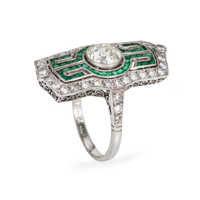 Stylish vintage Art Deco era diamond & emerald ring crafted in 900 platinum (circa 1920s). Center set old European cut...