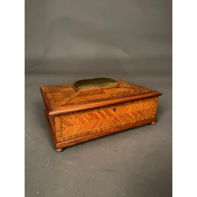 Charming 19th-century English inlaid satinwood sewing box, dating to circa 1890, featuring an elegant pincushion on top...