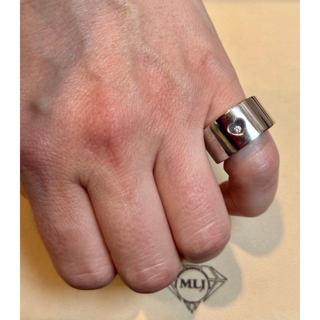 This classic 18k white gold ring from the Happy Diamonds collection by Chopard is a must-have for any jewelry enthusiast....