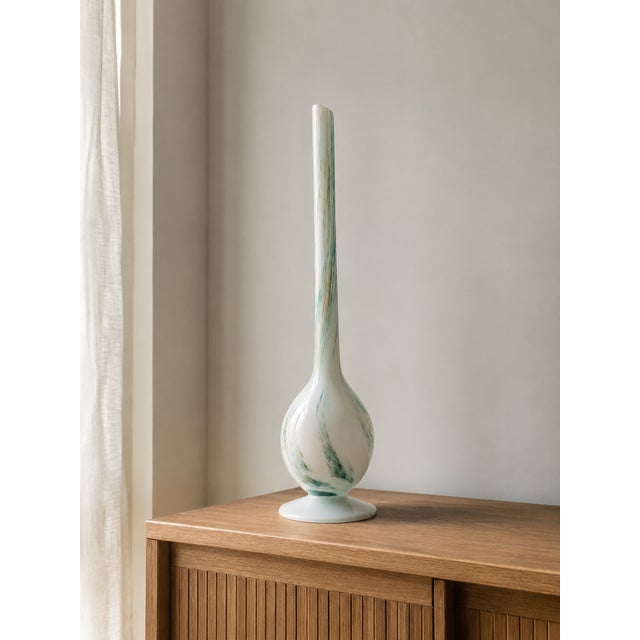 An elegant and collectible mid-century modern "solifleur" bud vase, masterfully handcrafted in italy by the renowned...