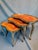 Exceptionally beautiful set of three interlocking side tables in an elegant kidney shape. The legs are richly decorated...