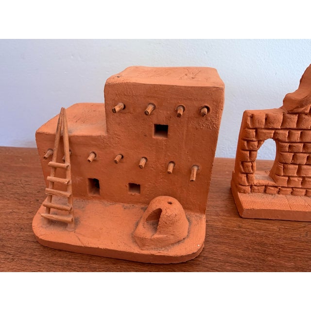 Pair of miniature Southwestern terracotta adobe structures. Handmade and signed by maker, dated 1985. Please see condition...
