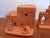 Pair of miniature Southwestern terracotta adobe structures. Handmade and signed by maker, dated 1985. Please see condition...