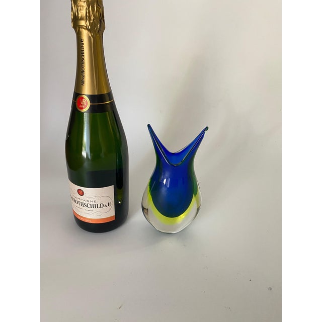 A beautiful vintage sommerso Italian art glass vase. Features a vibrant yellow interior surrounded by thick clear outer...