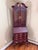 Part of the Georgian court collection in Chippendale style. The upper hutch has beveled glass doors, adjustable interior...