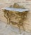 Italian Mid-Century Marble Top and Bronze Console This 1960s Italian console table has a brass frame with cornucopia and...