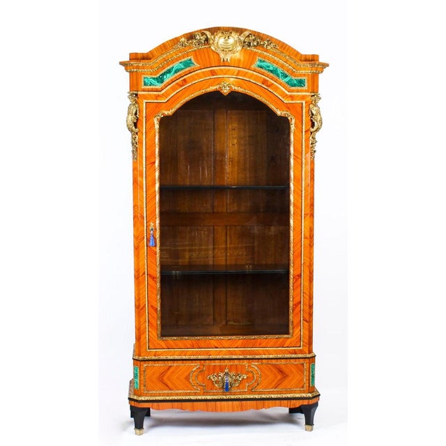 This is a beautiful antique French Malachite and Ormolu mounted vitrine in the French Louis XV manner, circa 1870 in date....