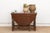The gateleg mechanism on this table — a pivoting leg that swings out from the base to support a drop-leaf when raised —...