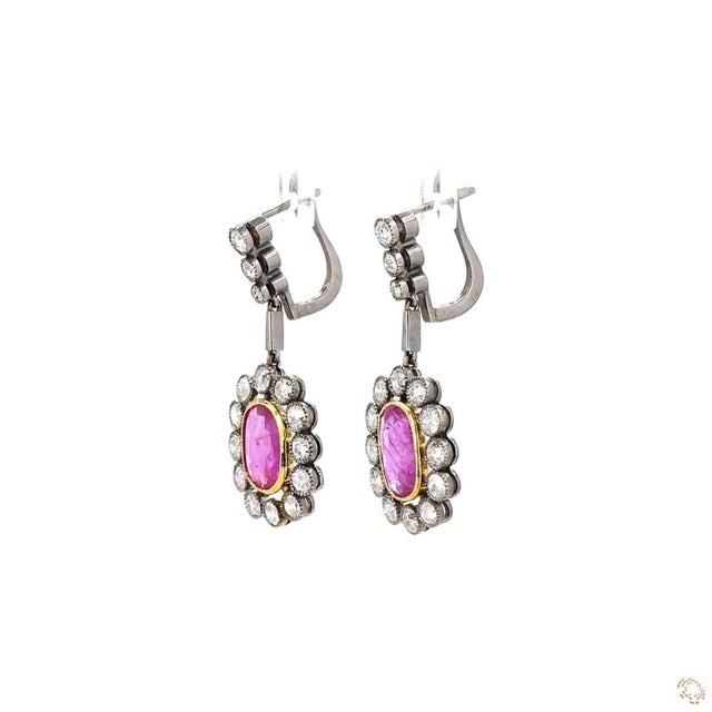 These estate earrings from our contemporary estate collection centers on a 2.04-carat diamond in an old European cut, an...