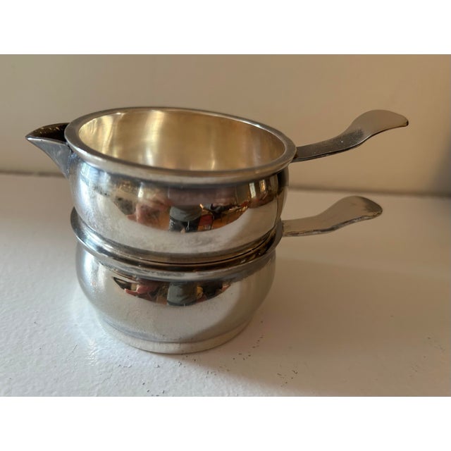 A vintage silver plated, portable sugar creamer service set, with small extended handle, with curved end. Excellent...