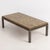 Mid century coffee table by French Maison Jansen, created with solid bronze. The tops is finished with mirrored églomisé...