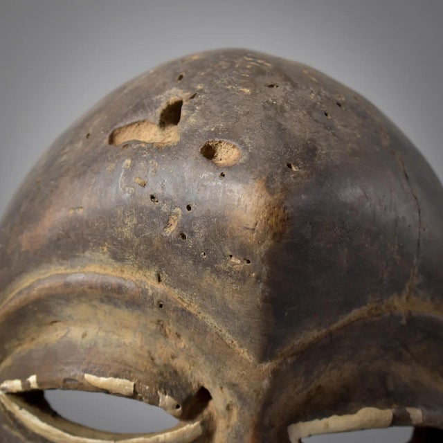 Dan masks, originating from the Dan people of Liberia, CÃ´te d'Ivoire, and Guinea, are recognized for their elongated...