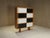 French 1970's black and white sliding door cabinet.