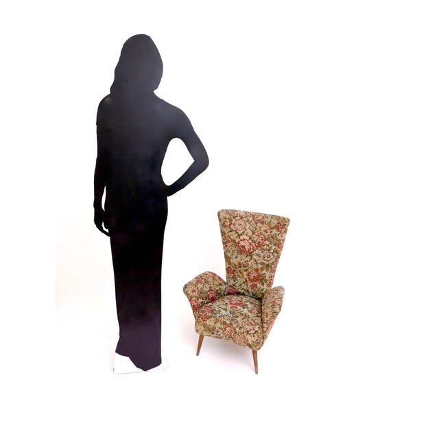 Made in Italy, 1950s. This children armchair is upholstered in its original fabric and features wooden legs. It may show...