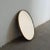 An elegant Italian oval wall mirror dating from the 1950s, distinguished by its refined proportions, minimalist design,...