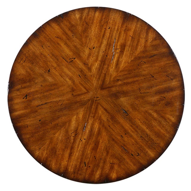 Very well made solid wood table. Features a clean and elegant design with flame sprays of veneers on top and bottom shelf....