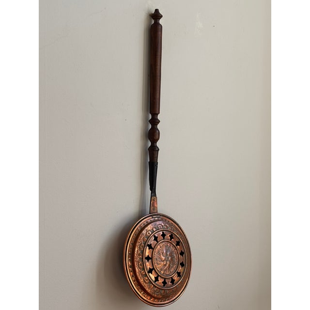 Offering a beautiful French copper bassinoire, or bed warmer, handcrafted by L. Lecellier of Villedieu-les-Poeles,...