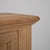 A Brutalist buffet in oak with iron hardware and strong, geometric construction. The design emphasizes thick materials and...