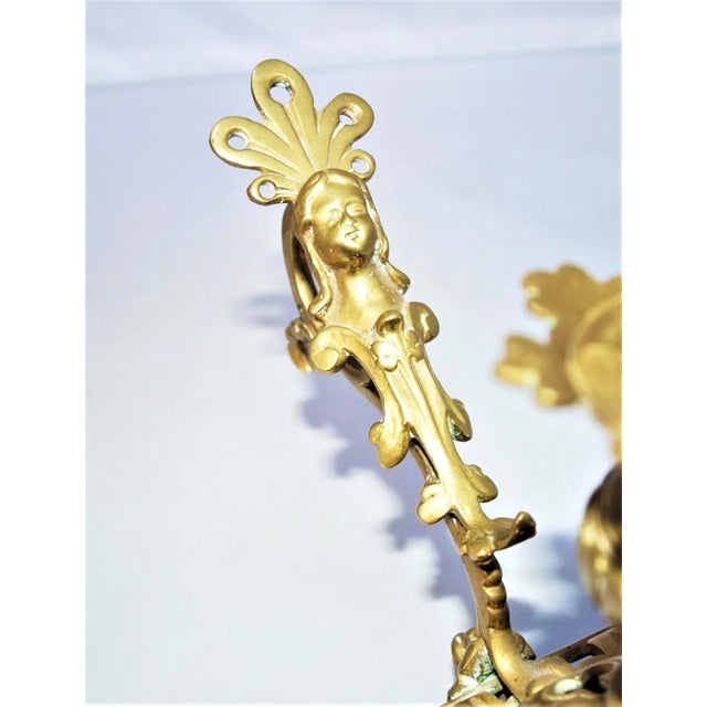 Antique brass chamber candle stick. Woman’s face and crown finger handle. Chamber candlestick was made to carry lite...