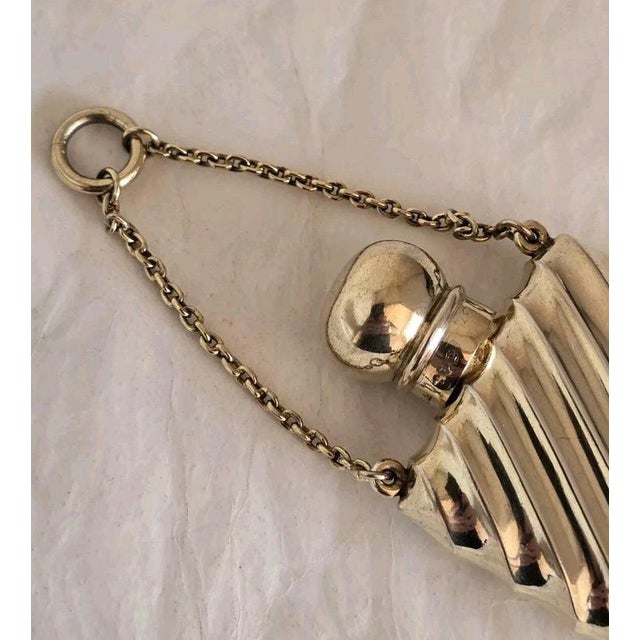A fine Victorian sterling silver and gilt scent bottle by the renowned silversmith **Sampson Mordan & Co.**, featuring an...
