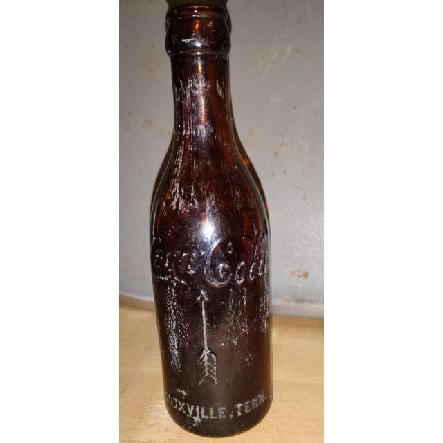 Antique early arrow script, amber straight sided Coca Cola bottle circa 1900-1915 is a piece of soft drink history....