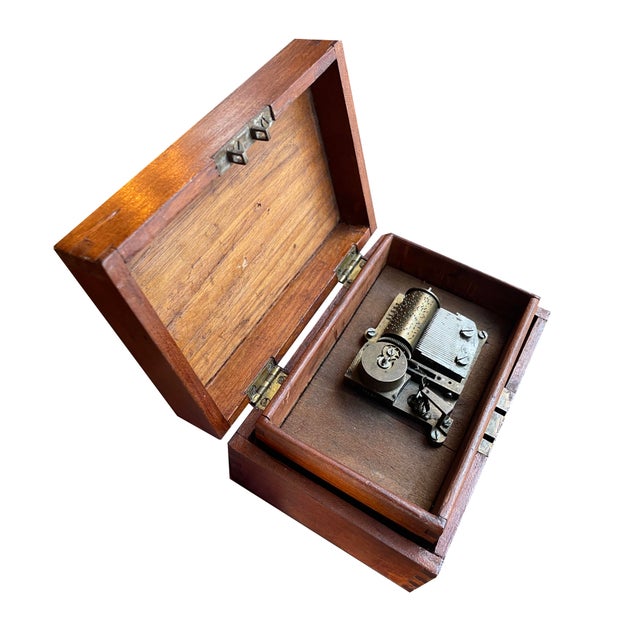 Not just any 1800s walnut music box — this is a rare Swedish (likely Thorens) multi-song music box with an ingenious...